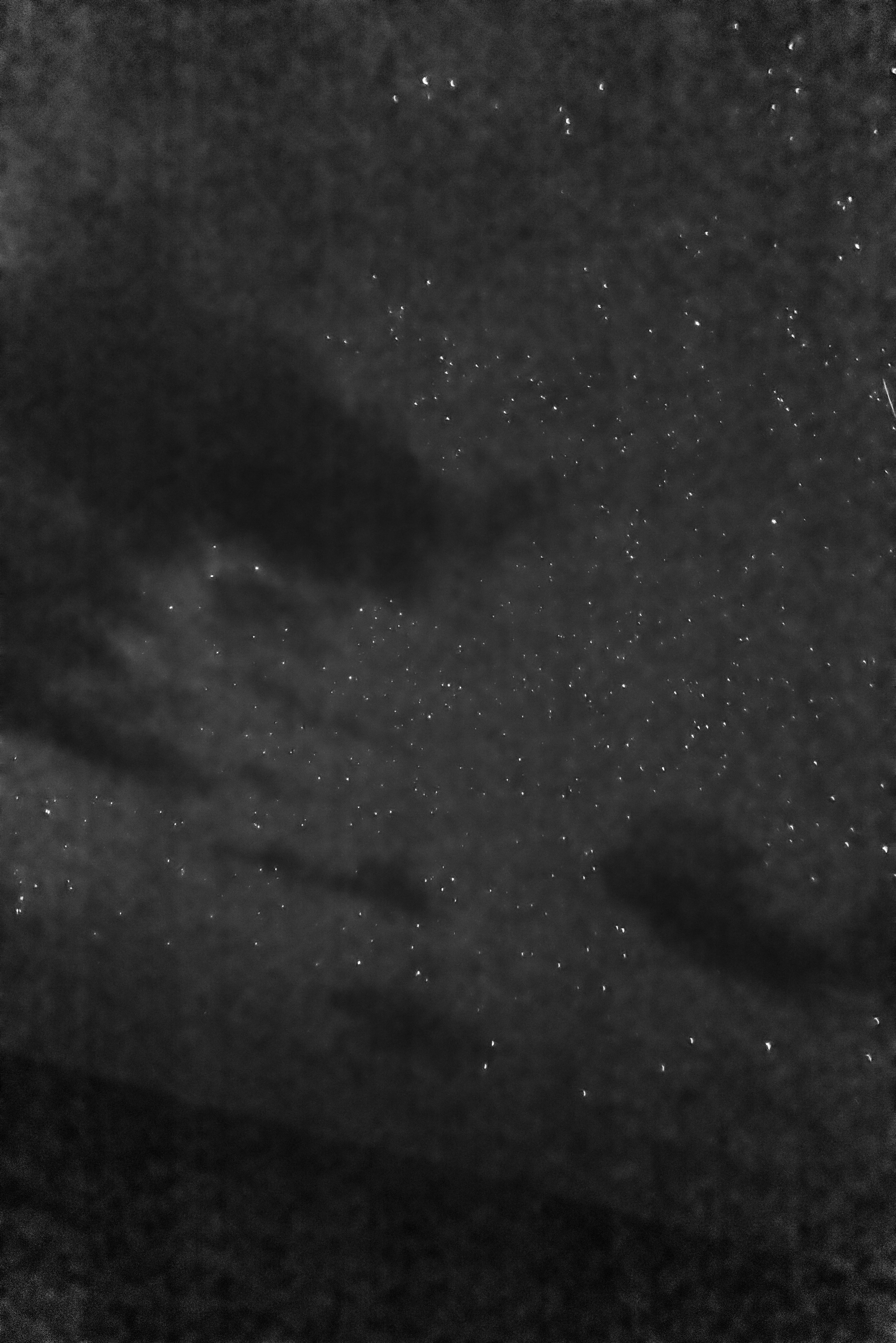 Stars and clouds at night at sea